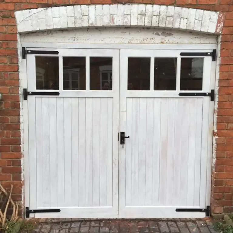 Insulated version of our Aberconway garage doors painted white